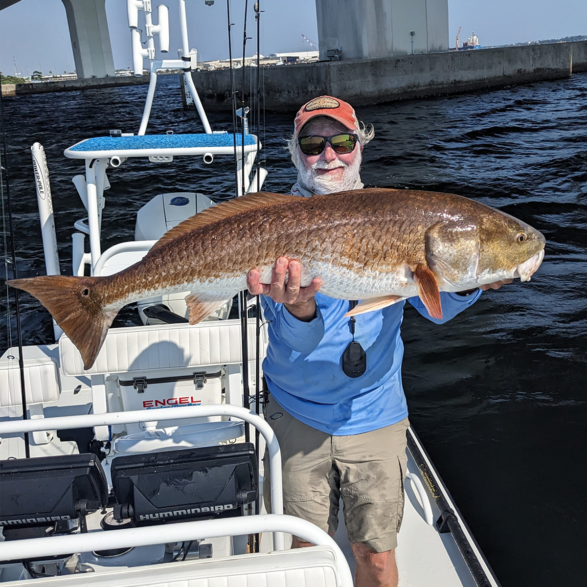 big redfish charter captain with a big redfish
