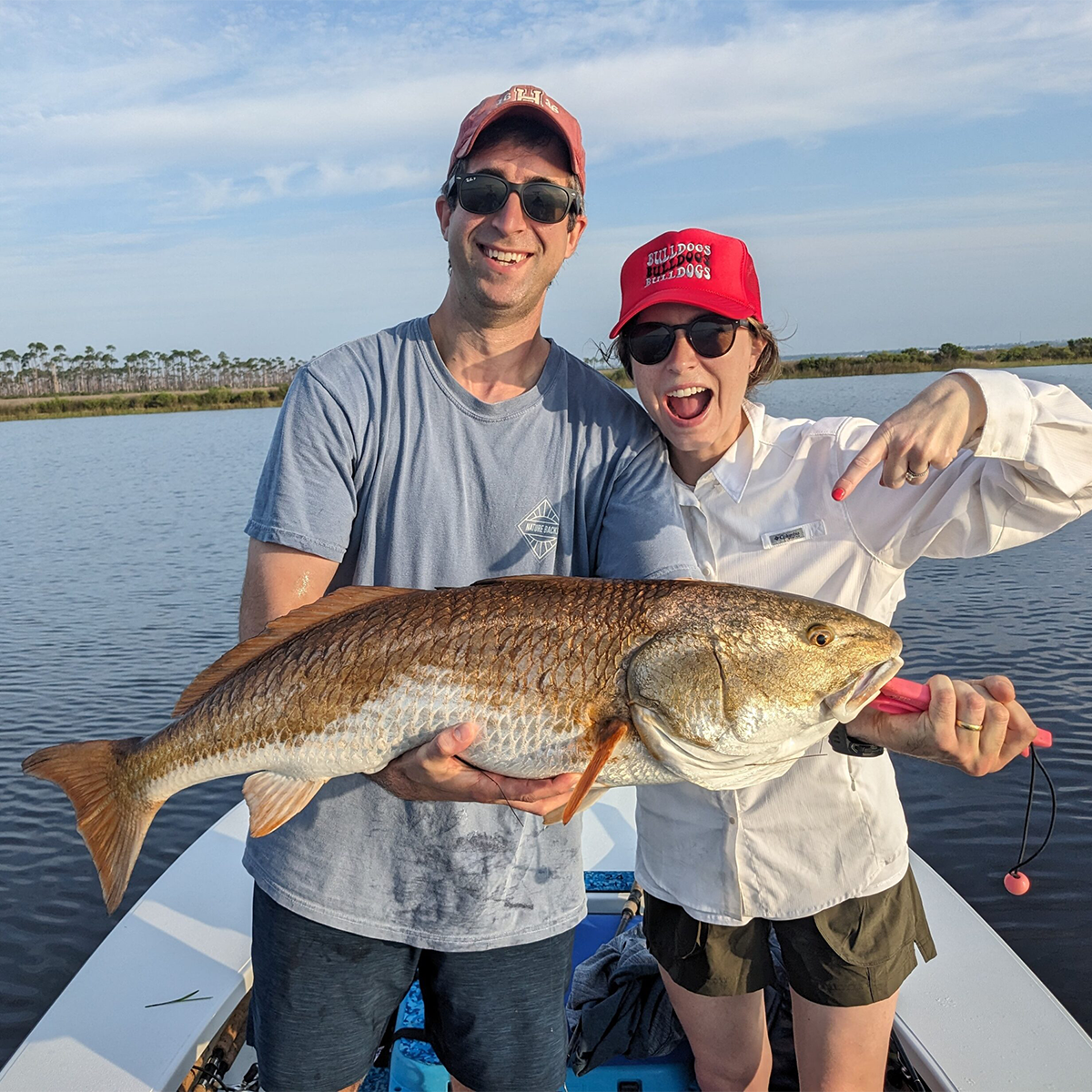 charter fishing clients with a big red charter fishing clients with a big red